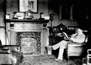 William Henry Allen reading in the library at Bromham House [Z50/21/30]